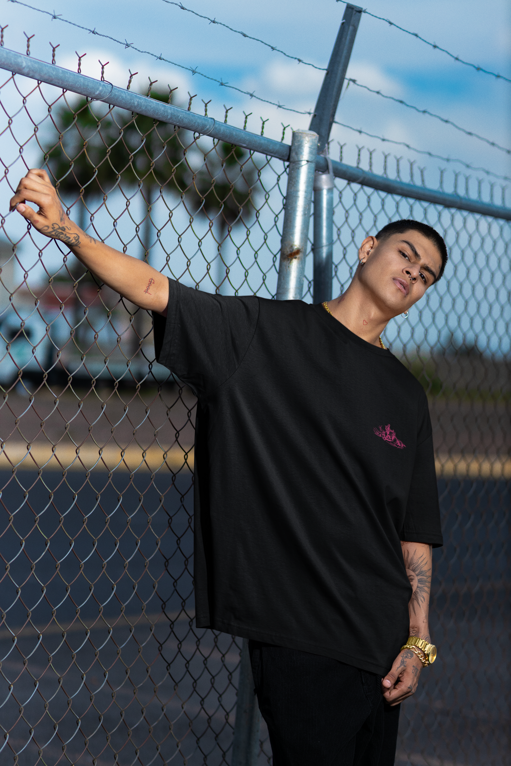 Monochrome Pink Embroidery Design of a Biker Riding a Chopper-Style MotorcycleUnisex Oversized Classic T-Shirt